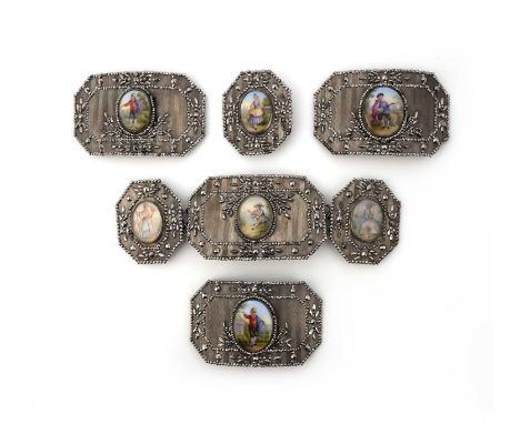 A collection of cut steel and enamel belt plaques, 19th century, each of cut-cornered rectangular design in engraved and stud