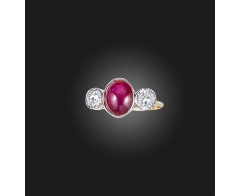 A ruby and diamond ring, collet-set with a cabochon ruby weighing approximately 5.50 carats, to shoulders set with circular-c