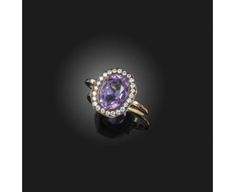 No reserve - an amethyst and diamond cluster ring, the oval amethyst set within a surround of diamonds in silver and gold, si