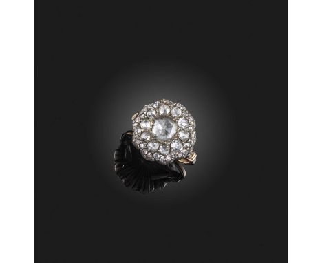 A diamond ring, 19th century, designed as a cluster of rose-cut diamonds, mounted in silver and gold in closed-back settings,