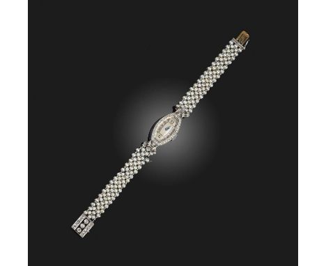 A lady's Art Deco seed pearl and diamond cocktail watch, circa 1920, the tonneau-shaped silvered dial with black enamel indic