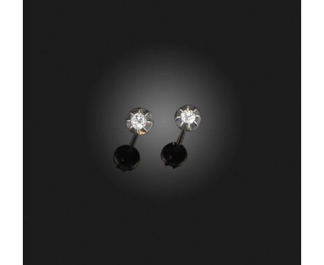 A pair of diamond studs, each set with an antique cushion-shaped diamond, to collet settings in silver and gold, post fitting
