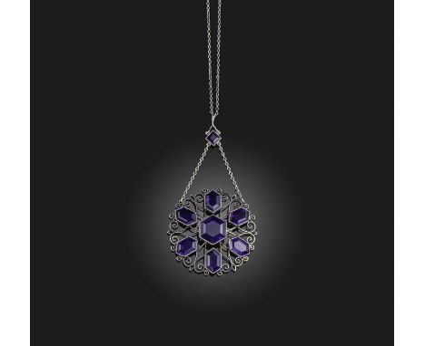 An unusual Arts and Crafts amethyst pendant necklace, early 20th century, the pendant of openwork design, set with a radiatin