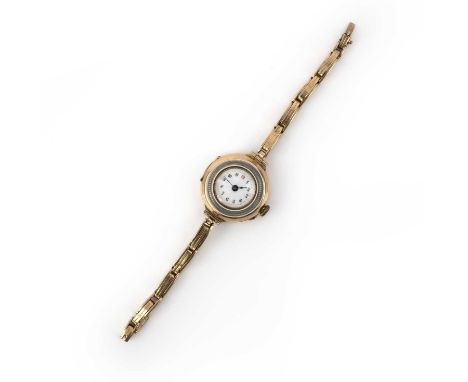 A gold wristwatch, circa 1913, the circular dial in white enamel with blued steel hands, to a gold case bordered with white a