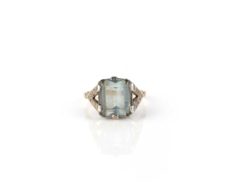 An aquamarine and diamond ring, claw-set with a step-cut aquamarine weighing approximately 6.00 carats, to shoulders set with