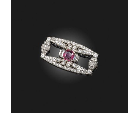 An Art Deco ruby and diamond brooch, 1920s, claw-set with a cushion-shaped ruby weighing approximately 1.10 carats, within a 