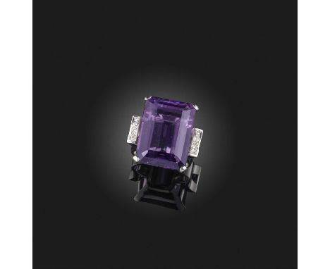 An amethyst and diamond ring, circa 1940, the step-cut amethyst flanked with arced diamond shoulders in white gold, size H1/2