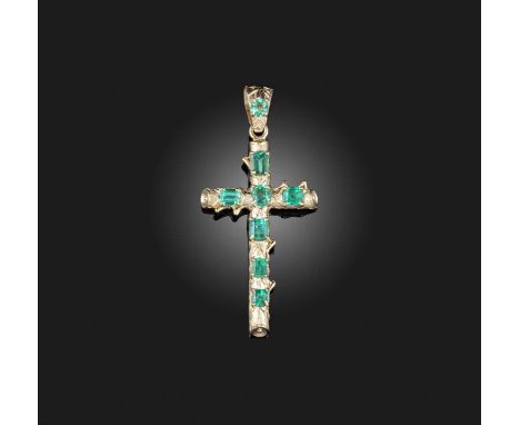 An emerald pendant, designed as a cross, engraved naturalistically with woodgrain and branches, set with circular, oval and s