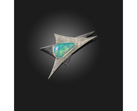 An opal brooch, 1970s, set with a freeform cabochon opal to an abstract geometric mount in white gold, length 6.5cm