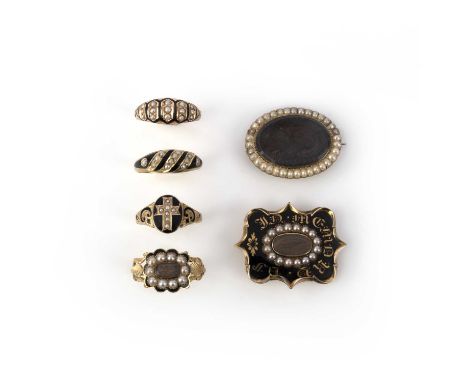 A collection of Victorian mourning jewels, 19th century, comprising: four gold rings applied with black enamel and set with h