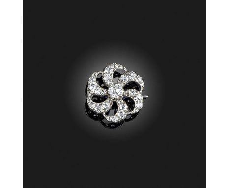 A Victorian diamond brooch, late 19th century, designed as a stylised flower with swirled petals, set with circular-cut diamo