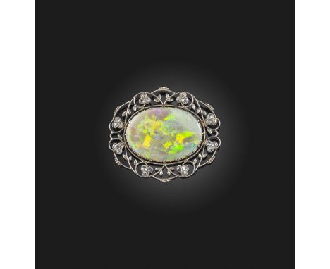 An opal and diamond brooch/pendant, early 20th century, set with a large opal, within a foliate platinum mount set with rose-