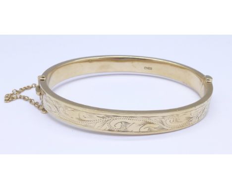 A 9ct gold bangle, 12.4g