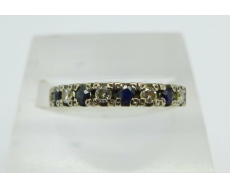 An 18ct gold, diamond and sapphire half eternity ring, 2.6g, N