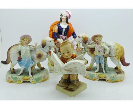 A pair of bisque figures, one a/f, a Hummel figure of a boy seated reading a newspaper and a Staffordshire figure, small chip
