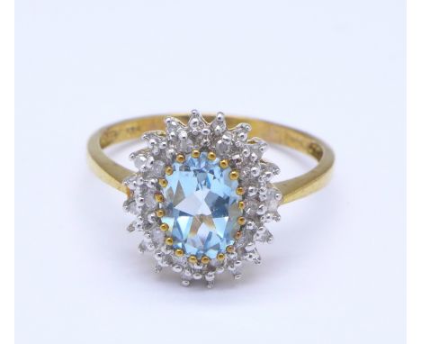 A 9ct gold, blue stone and diamond cluster ring, 2.6g, R, stone 9mm x 6mm