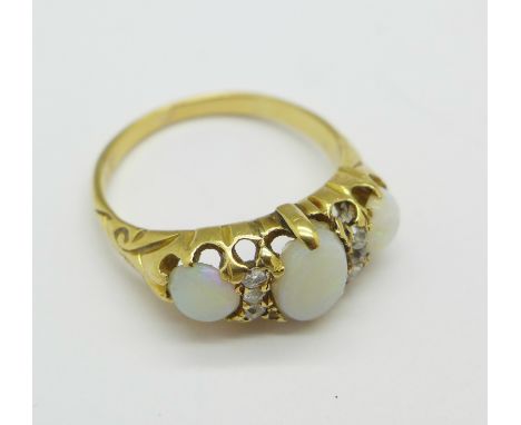 A yellow metal, three stone opal and old cut diamond ring, 3.3g, K, one opal chipped