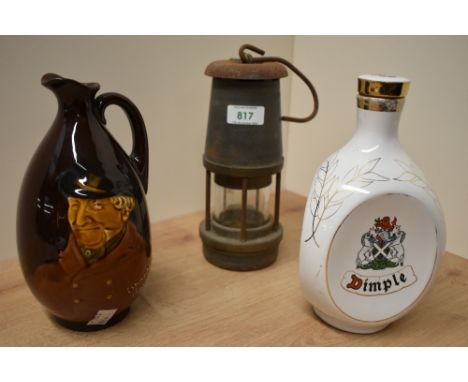 A Royal Doulton 'Sporting Squire' whiskey jug (no stopper), a Los Angeles 1984 commemorative dimple bottle and a Wolf Safety 