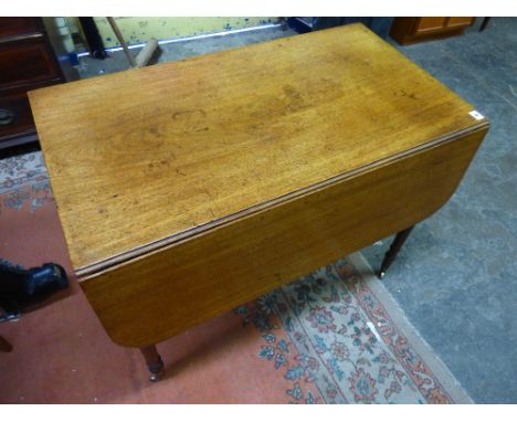 REGENCY PERIOD MAHOGANY PEMBROKE TABLE ON RING TURNED TAPERED LEGS WITH BRASS CAPS AND CASTORS