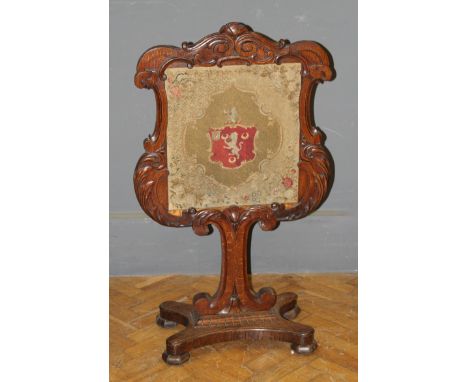 An oak tapestry firescreen with coat of arms, marked verso Fonthill school of furniture, Wiltshire