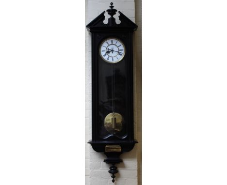 Oversized six foot Vienna regulator in an ebonised case. two piece enamel Dial with seconds subsidiary marked E.A.Smith of Bu