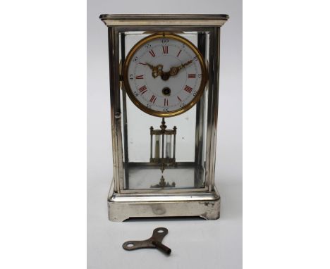 A four glass mantle clock with mercury pendulum, enamel dial with Arabic and Roman numerals, the latter in red 30cm H x 18cm 
