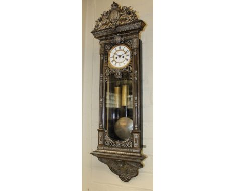 19th Century Cast Iron Double Weight Vienna Regulator Wall Clock. The silvered and gilt cast-iron case having a winged cherub