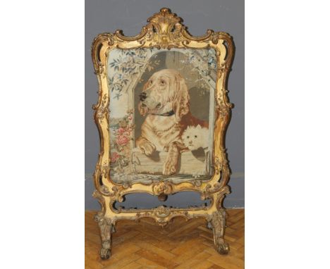 A 19th Century giltwood firescreen in the Rococo style, inset with a tapestry depiction of Landseers Dignity and Impudence. P
