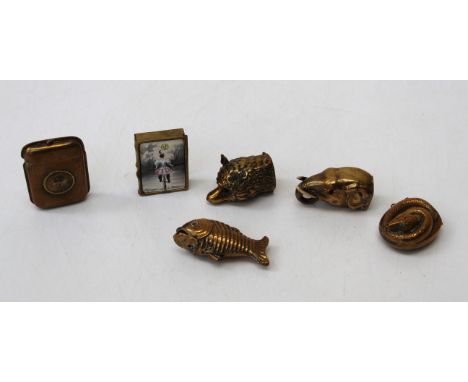 Six various late 19th / early 20th century brass vesta cases comprising a serpent case, a fish case, an elephants head case, 