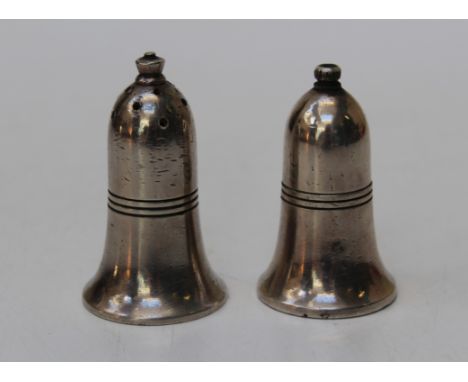 A pair of broad arrow 1956 salt and pepper shakers. W batty &amp; son Ltd, Manchester