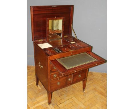 A George III mahogany military campaign gentleman&rsquo;s chest hinged lid revealing an adjustable rising sash mirror various