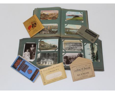 Two early 20th century postcard albums, containing many dozens of cards, including photographic topographical, portrait, some