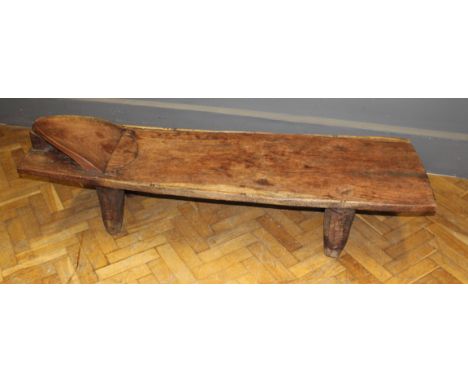 An African Ivory Coast carved Senufo bed C.1910, carved from single trunk.