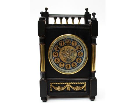 A late Victorian Aesthetic Movement ebonised cased mantel clock, having pierced gallery above circular dial, with gilt Arabic