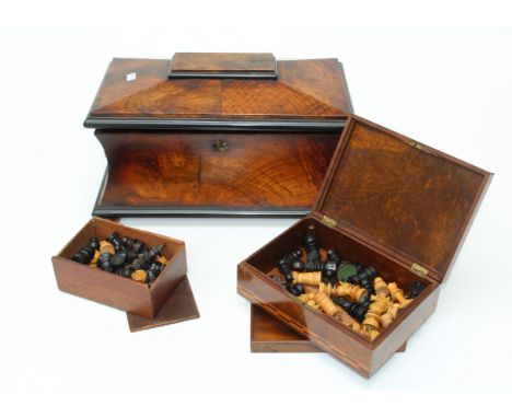 A large Victorian figural walnut tea caddy width 39cm and a boxed set of Staunton type chessmen and another similar incomplet