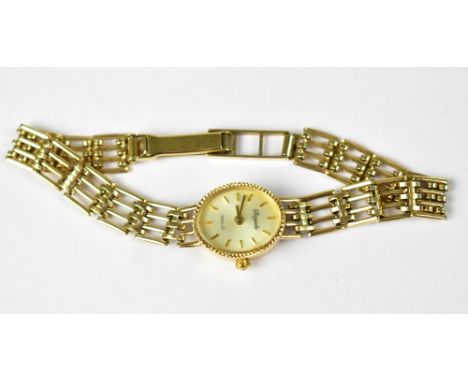 ROYALE; a ladies' 9ct gold wristwatch, the white oval dial set with raised gold baton numerals, on four bar 9ct gold gate bra