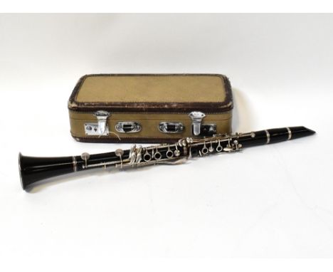 CONSOLE; a cased clarinet.