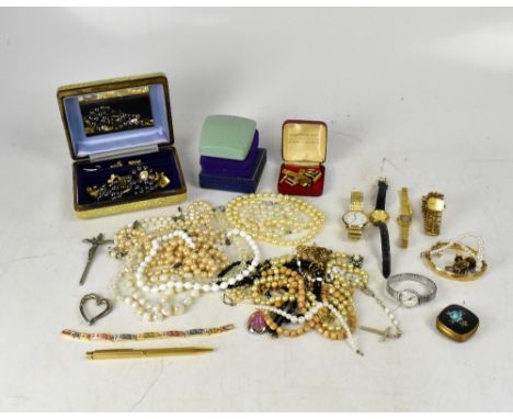 A quantity of vintage and contemporary costume jewellery to include white metal brooches, crucifix, earrings, chains, necklac