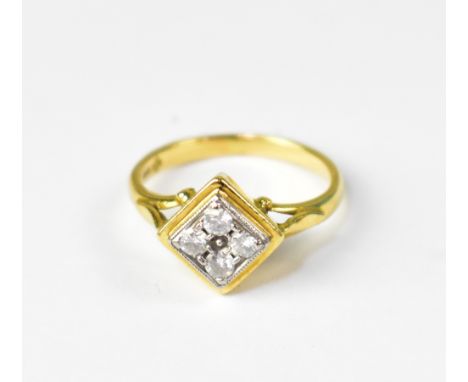 An 18ct gold Art Deco ring set with four small diamonds in square white gold mount, set within a yellow gold square mount wit