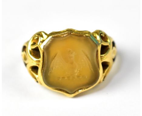 A Victorian yellow gold signet ring with intaglio shield with bird on branch, on ornate pierced shoulders, size M, approx 7.8