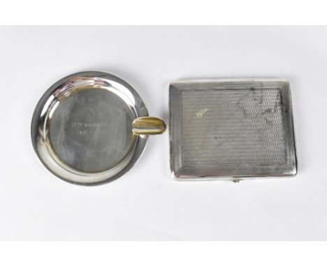 A George V hallmarked silver engine turned cigarette case, Chester 1920 and a hallmarked silver ashtray inscribed '17th Novem