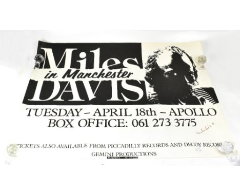 MILES DAVIS; a black and white poster from The Apollo in Manchester bearing his signature, folded rolled and unframed.We have
