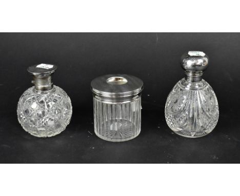 A George V ovoid cut glass perfume bottle with engine turned and fleur-de-lys chased decoration to the top, Walker &amp; Hall