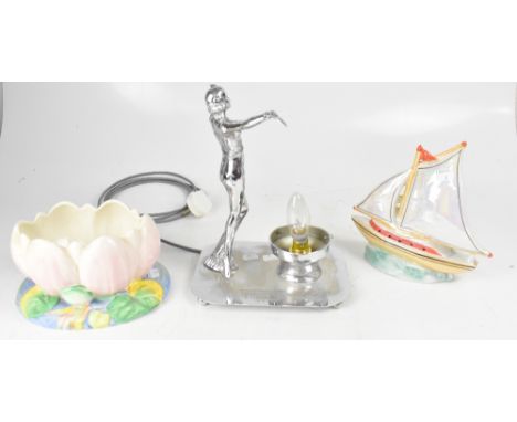 An Art Deco style figural table lamp modelled as a dancing lady, to rectangular base and small bun supports, engraved 'Lancas