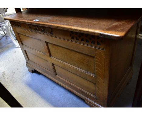 A small 20th century oak coffer with simple carved frieze and panelled front, raised on bracket feet, 56 x 91 x 46cm. CONDITI