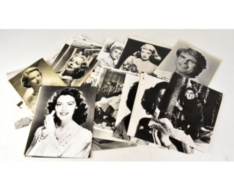 A large collection of movie still style lobby or stock cards, mostly black and white, to include Humphrey Bogart, Mel Gibson,