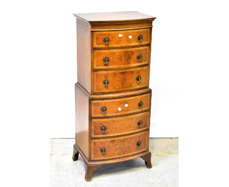 A reproduction mahogany and burr walnut bow front chest-on-chest of small proportions, the moulded top above three drawers to