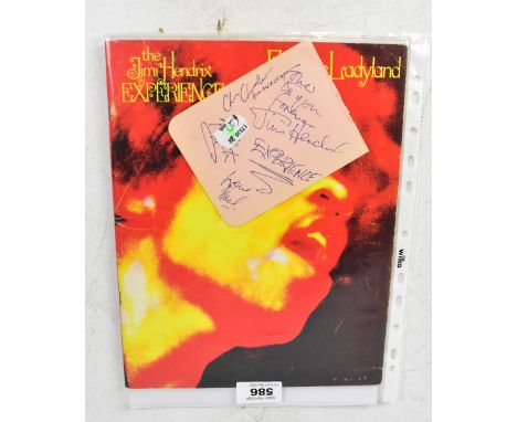 JIMI HENDRIX; a page taken from an autograph book bearing his signature, along with three others and a booklet for 'Electric 