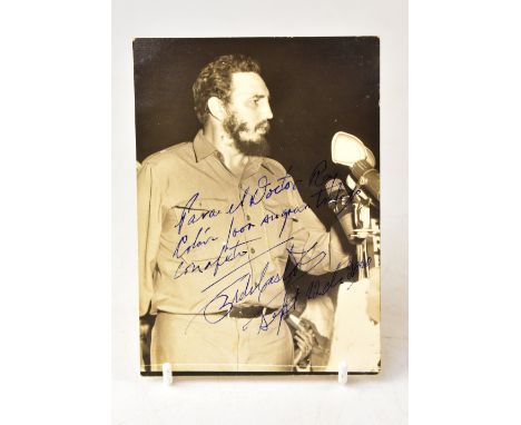 FIDEL CASTRO; a black and white photograph bearing the leader's signature, inscription and dated 2000, 14.5 x 10.5cm. We have