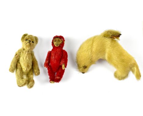 SHUCO; a 1950s novelty red monkey compact enclosing a small mirror and powder compartment with pad, height 9cm (af), also a s